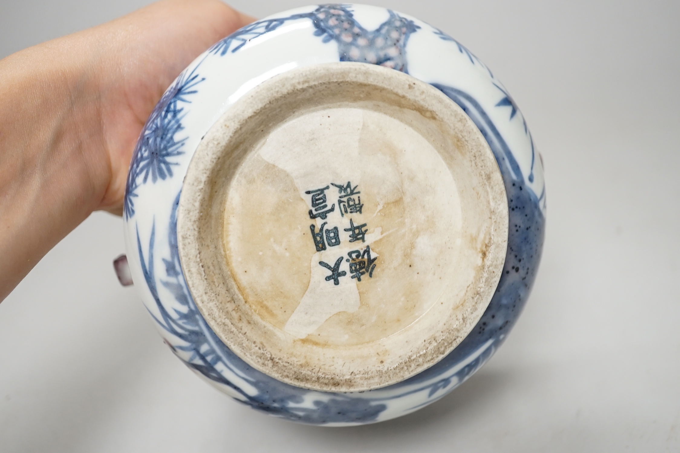 A Chinese underglaze blue and copper red pot and cover, 12cm high